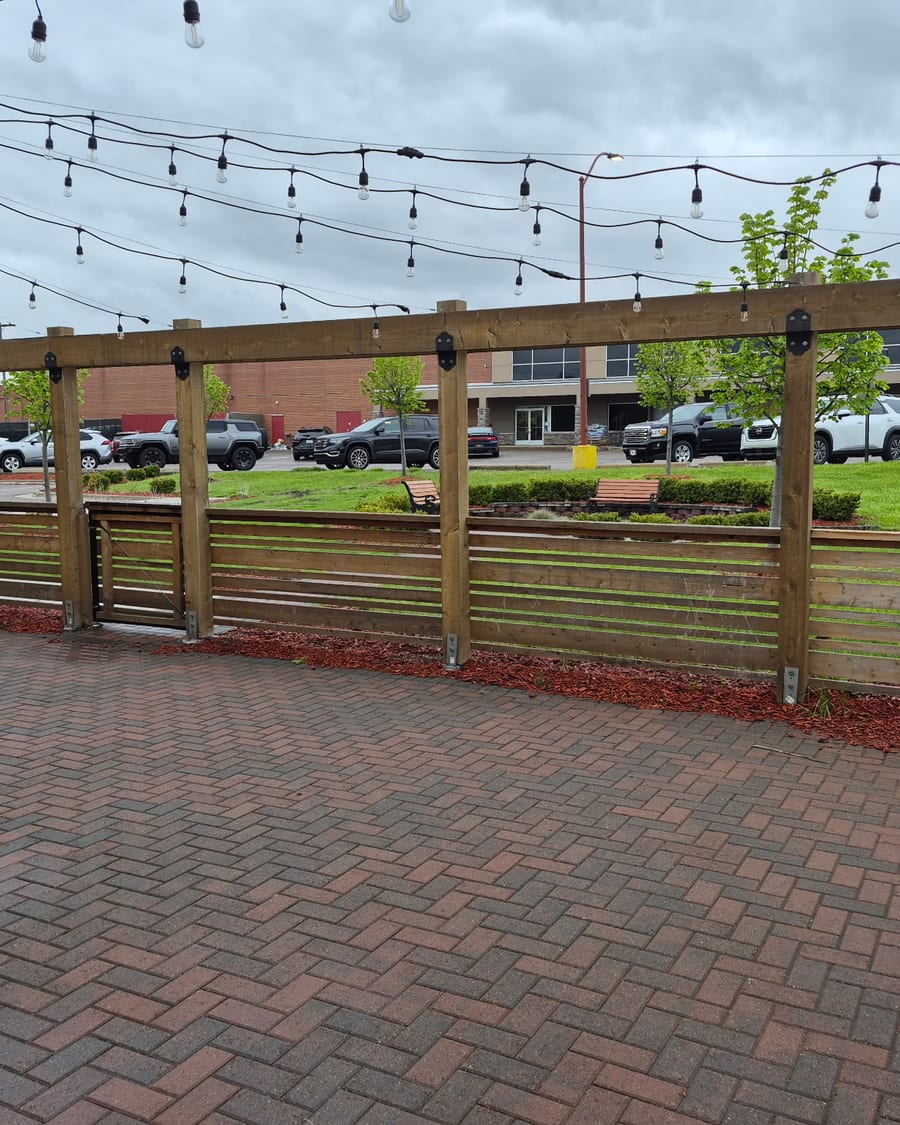 The brick patio strung with lights, ready for summer