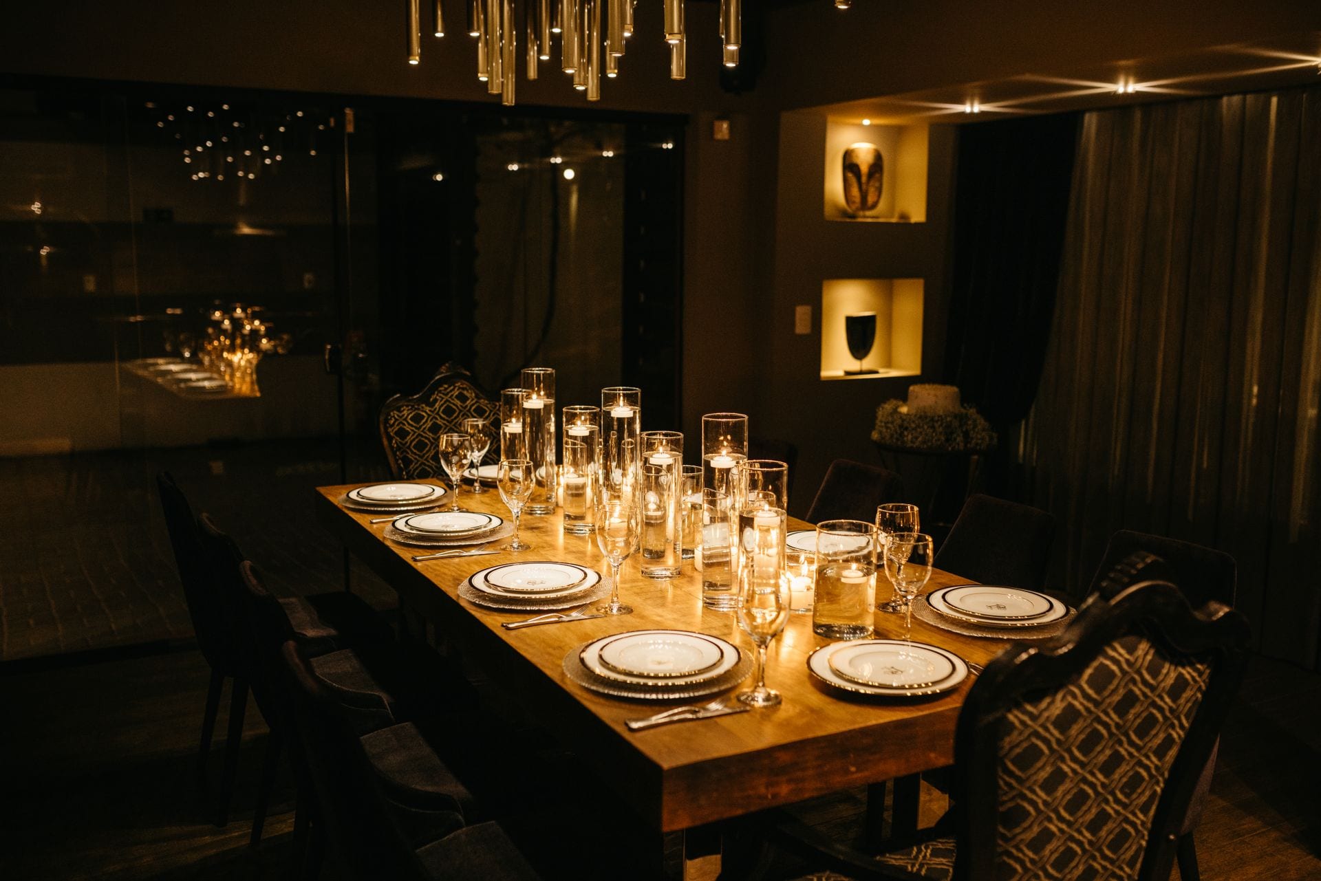 Warm candlelight over a welcoming dining room